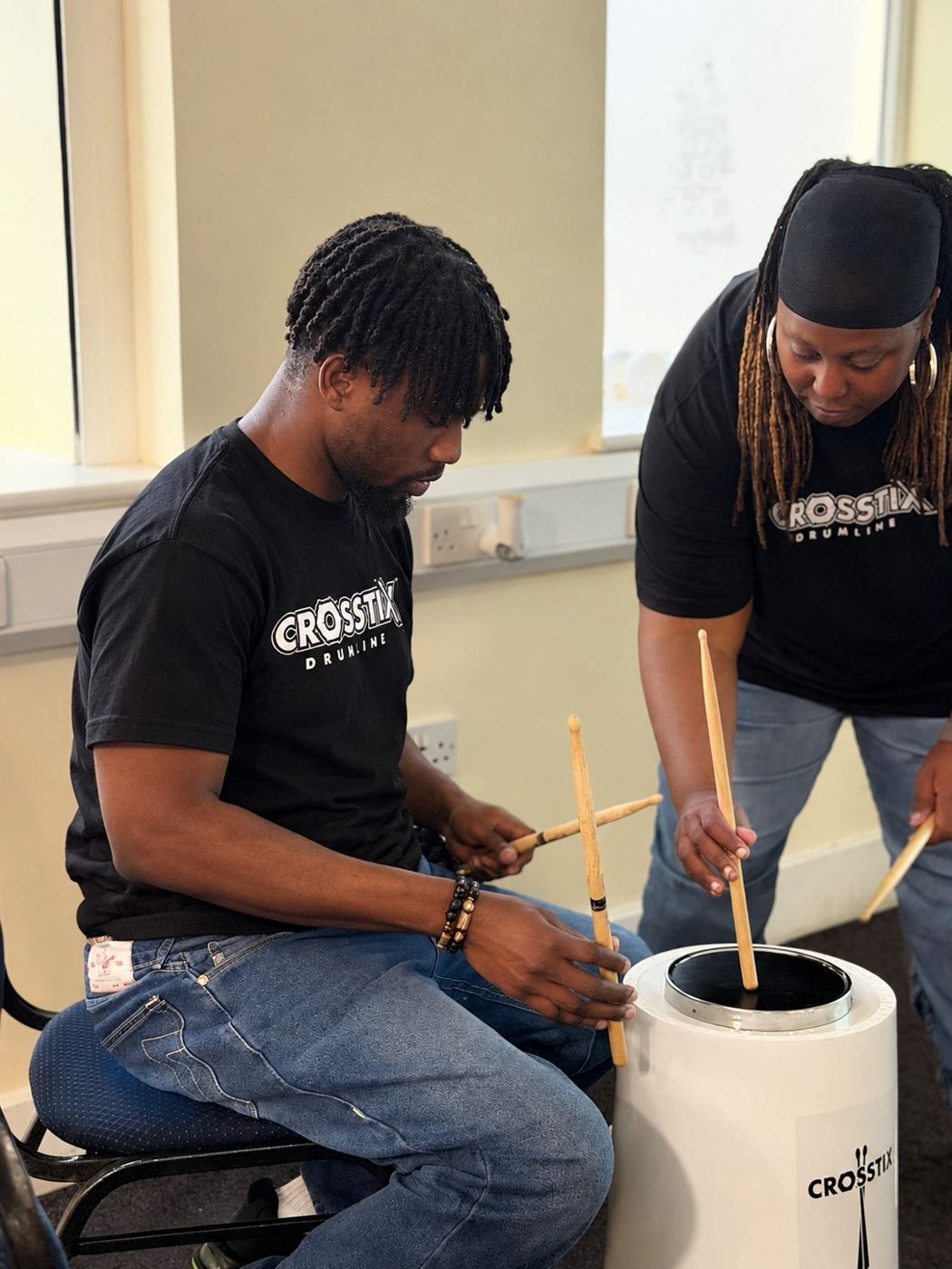 An adult learner being coached on technique