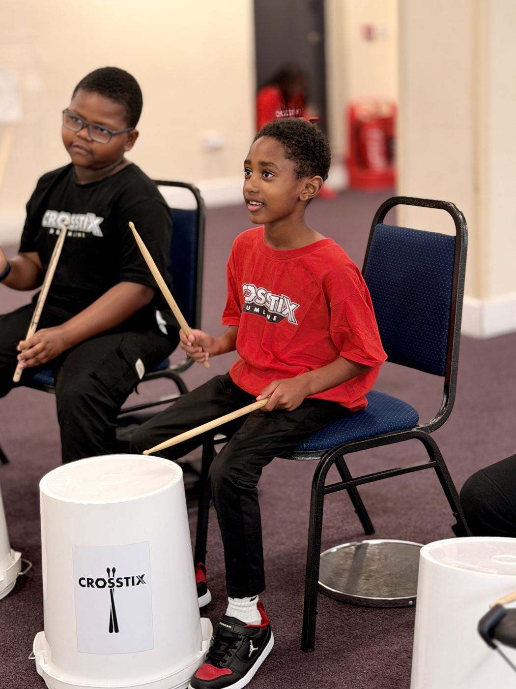 Two academy members grinning at each other mid-session