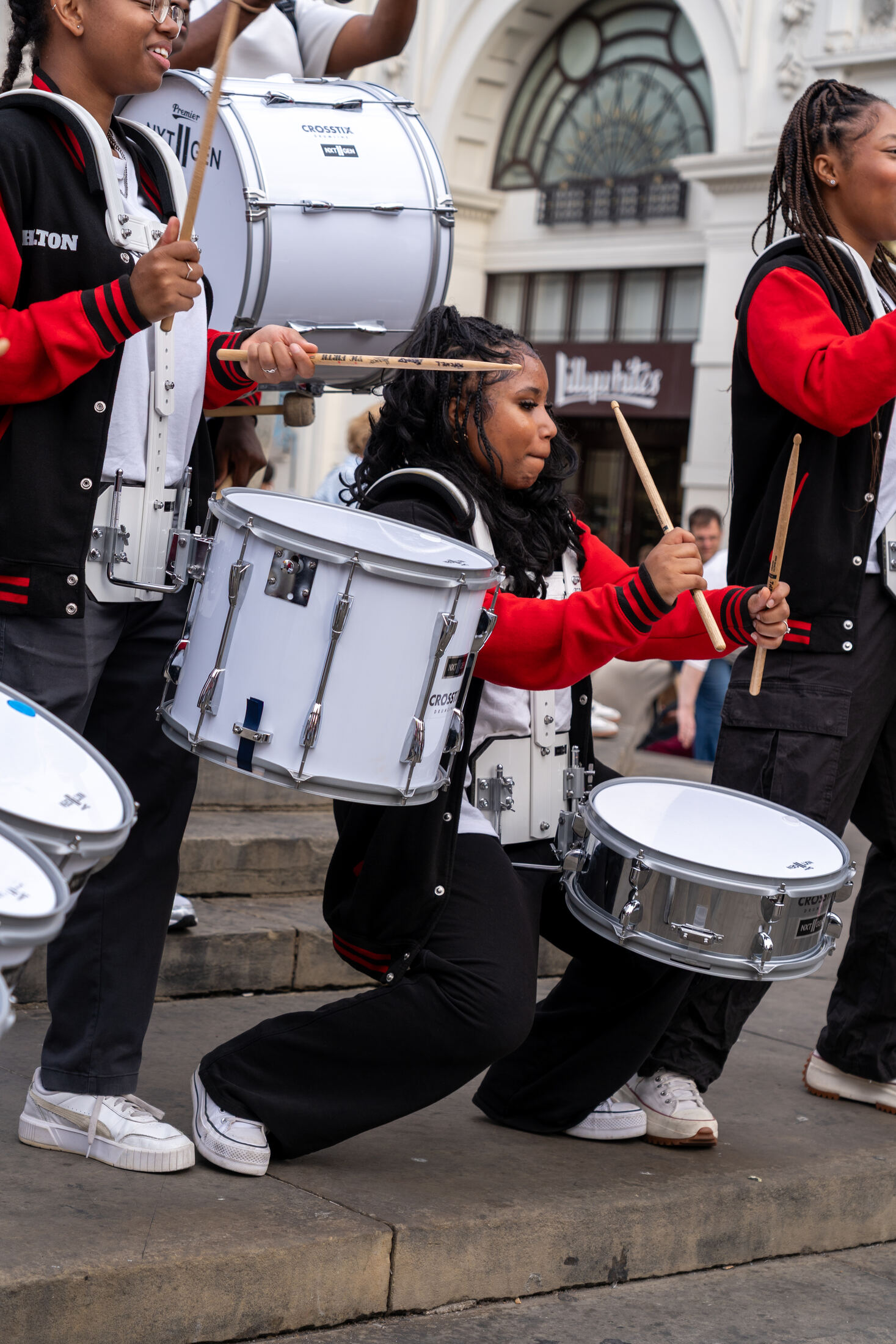 Snare drummer kneeling mid-routine