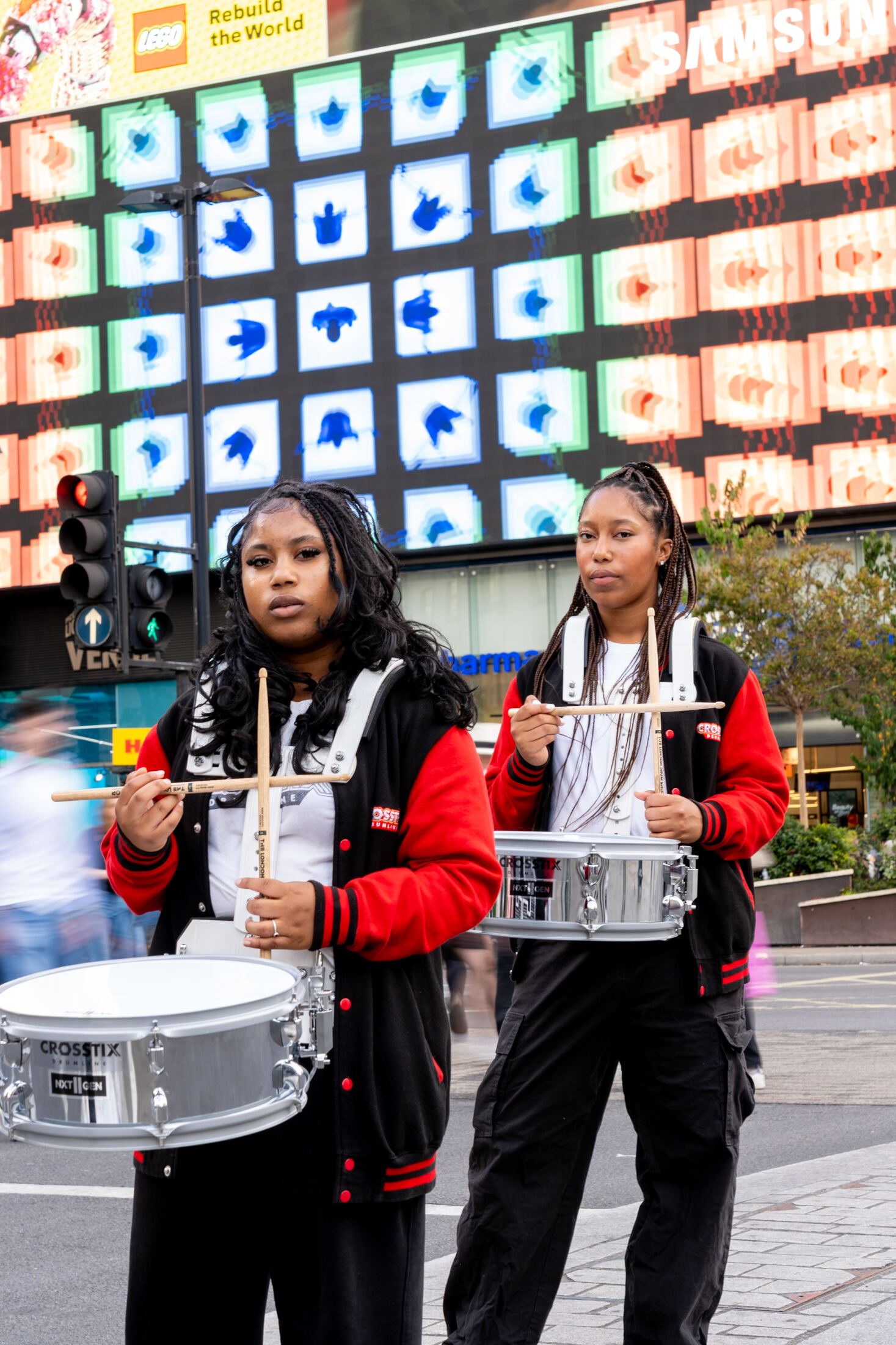 CrosStix snare drummers under the screens at Piccadilly Circus